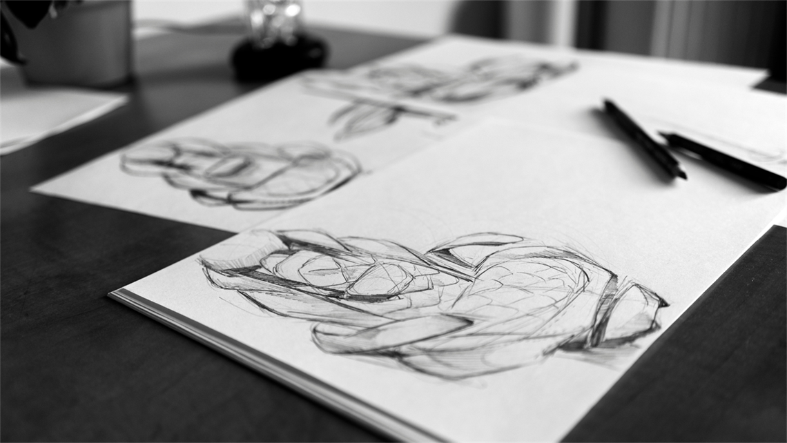 Black and White Image showing a sketch on a table